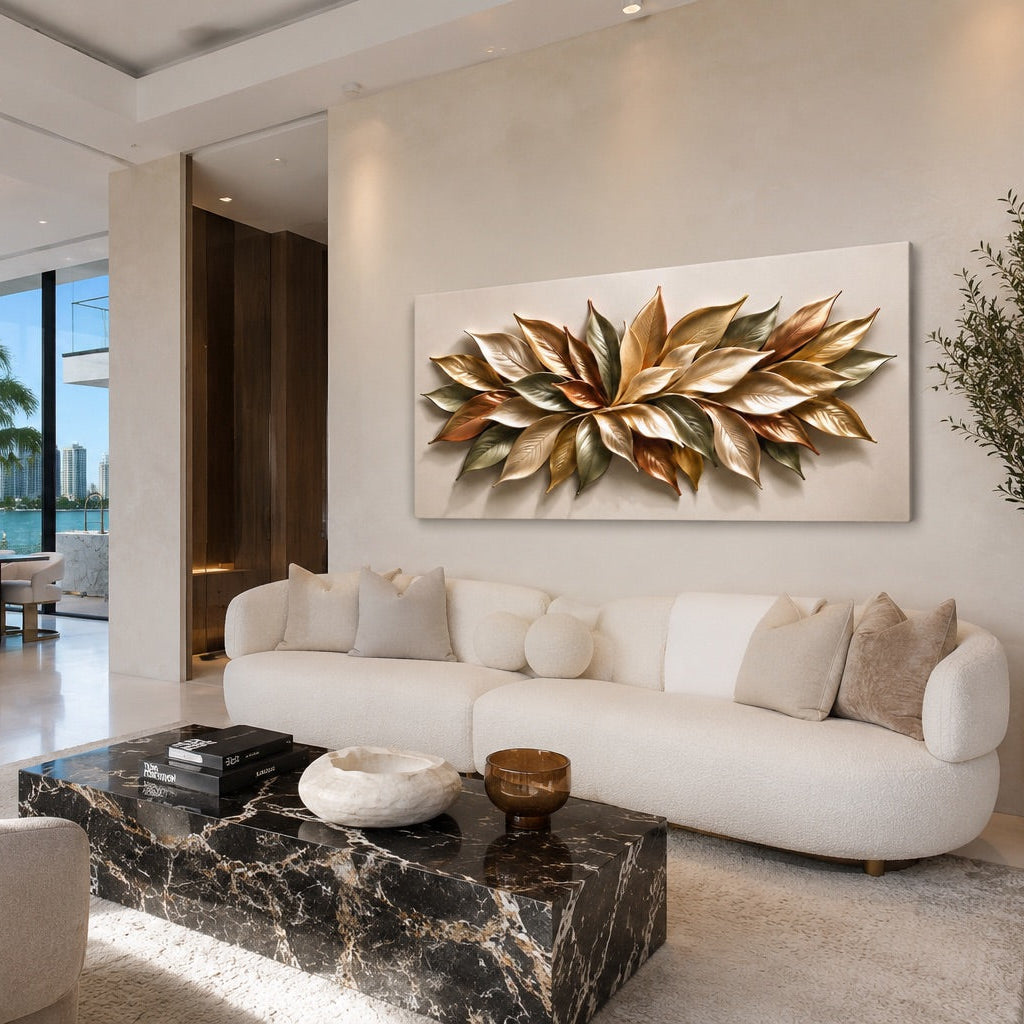 A modern living room featuring a large rectangular wall art piece with a 3D metallic gold leaf design mounted on a beige wall above a white curved sofa.