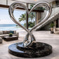 Modern interior with a large metallic heart sculpture in a living room.