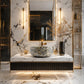 Luxury modern bathroom featuring a floating vanity with a textured mosaic vessel sink, gold fixtures, and white marble walls and floor with black veining.
