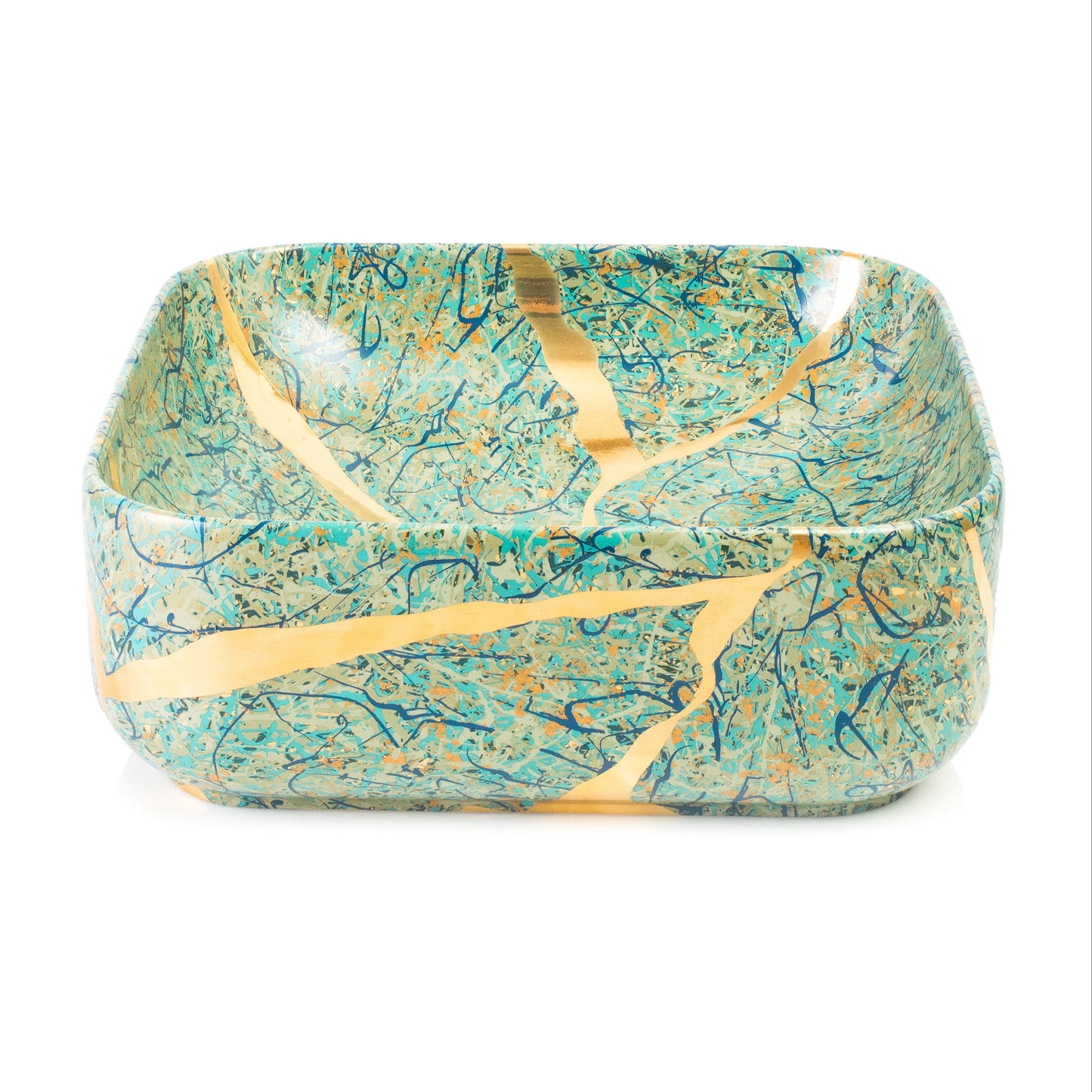 A square ceramic bowl with rounded corners, decorated with a turquoise and teal marbled pattern and accented by gold kintsugi-style cracks, shown on a plain white background.