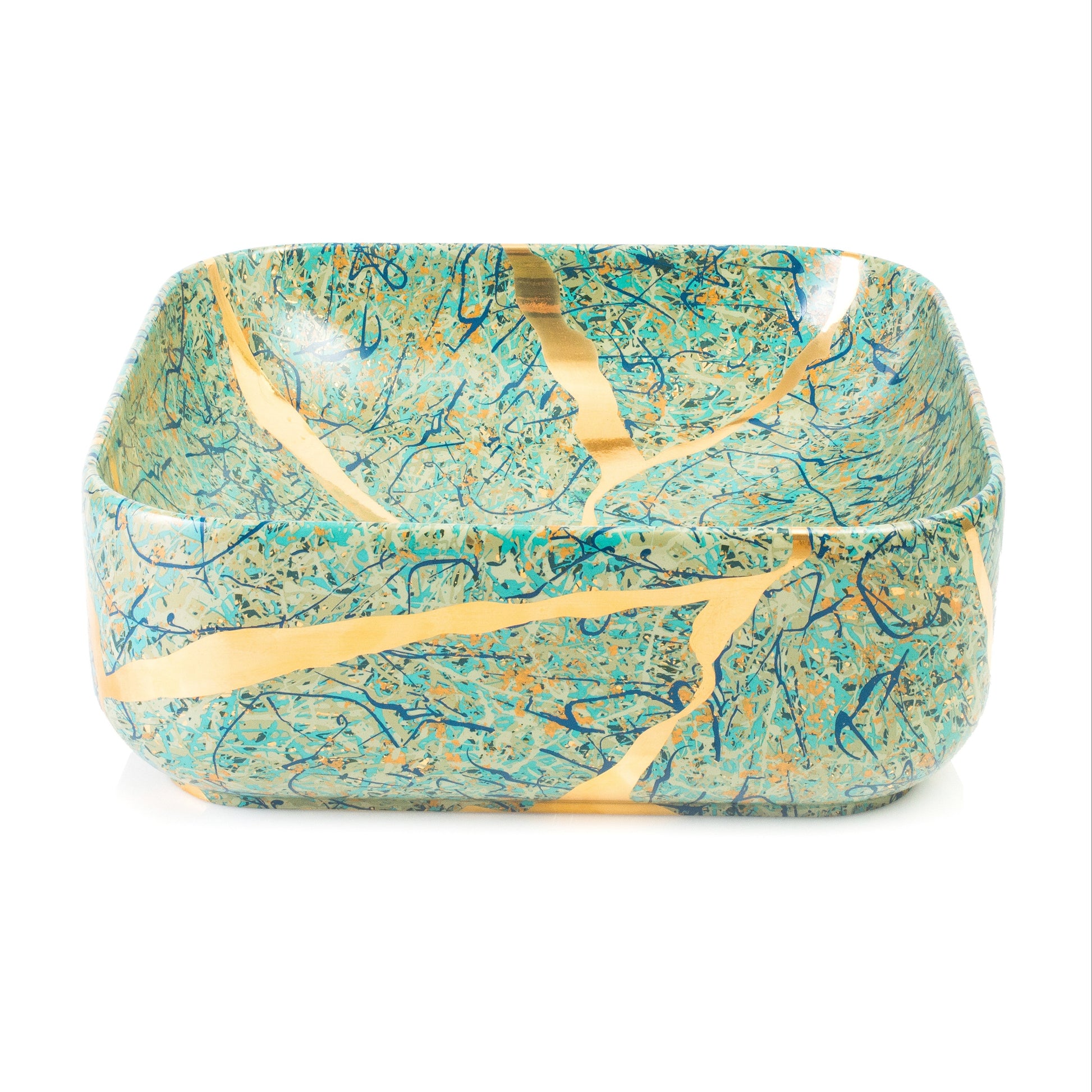 A square ceramic bowl with rounded corners, decorated with a turquoise and teal marbled pattern and accented by gold kintsugi-style cracks, shown on a plain white background.